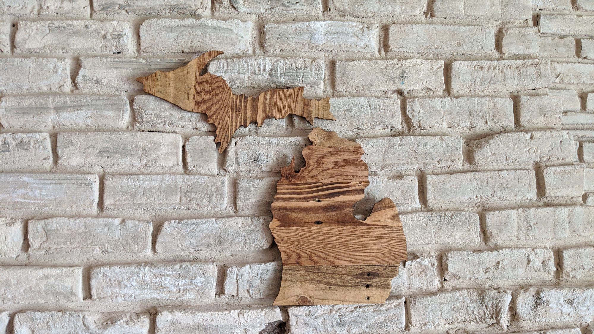 Rustic wooden wall art shaped like the state of Michigan